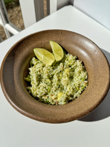 Avocado rice in brown bowl.