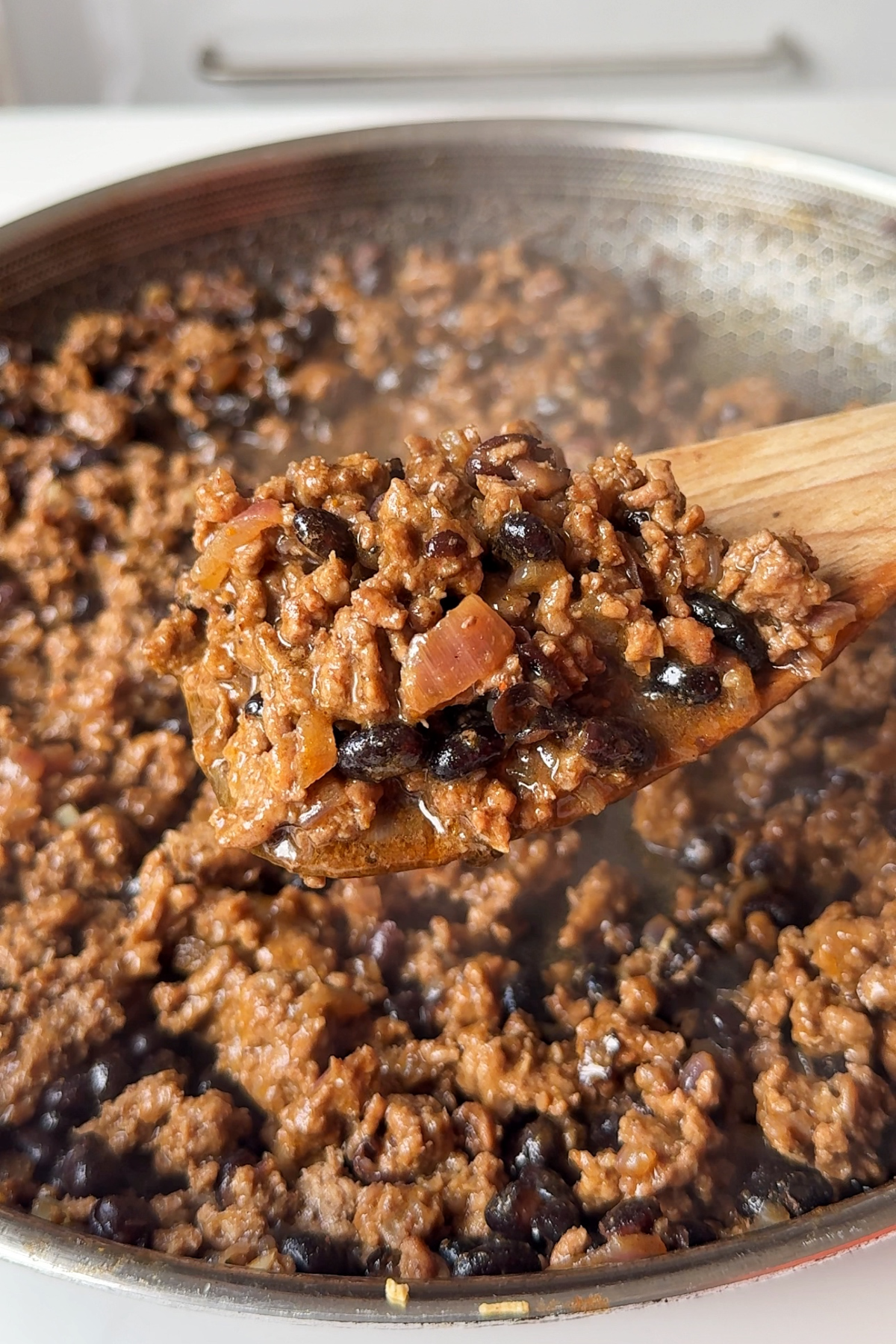 The beef mixture in the pan for the taquitos.