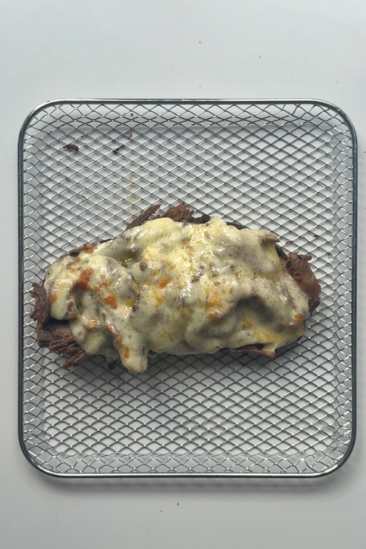 Assembling the lamb sandwich.