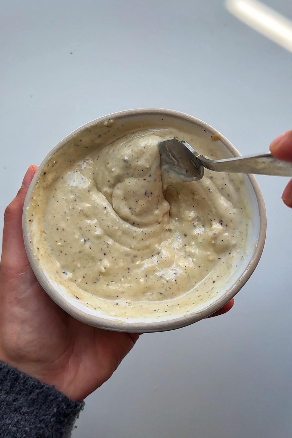 Blue cheese dressing sauce in a white bowl.
