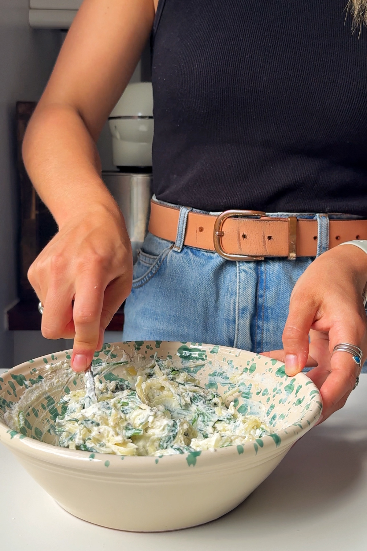 Making the ricotta and spinach filling for the crespelle.
