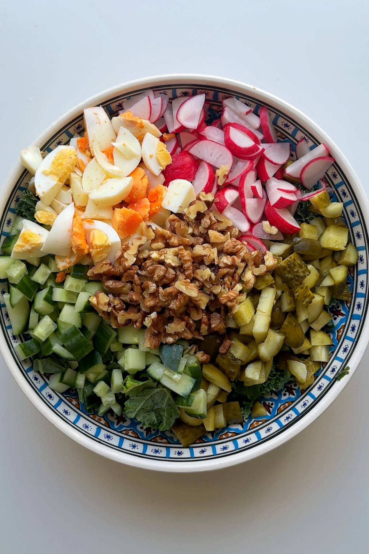 Chopped ingredients in a large salad bowl.