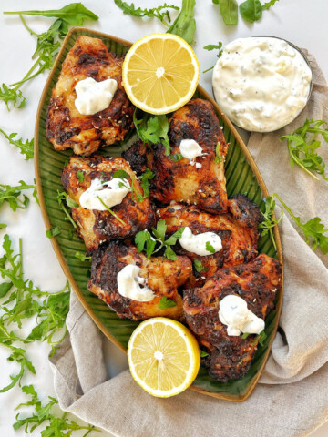 A dish with air fryer greek chicken and yogurt.