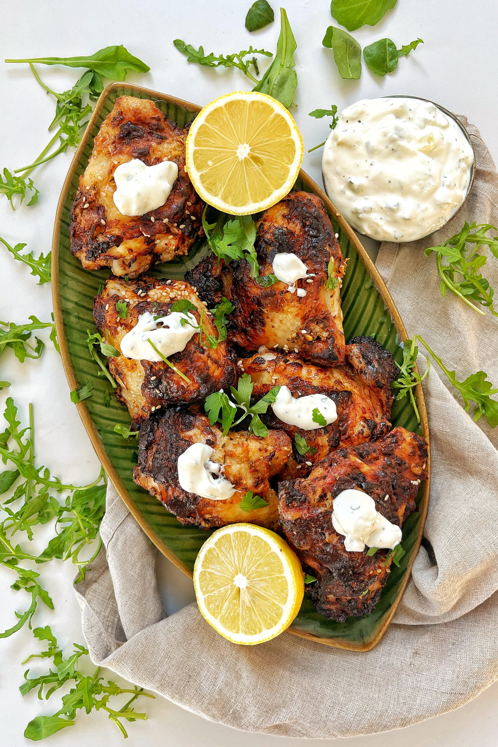 A dish with air fryer greek chicken and yogurt.