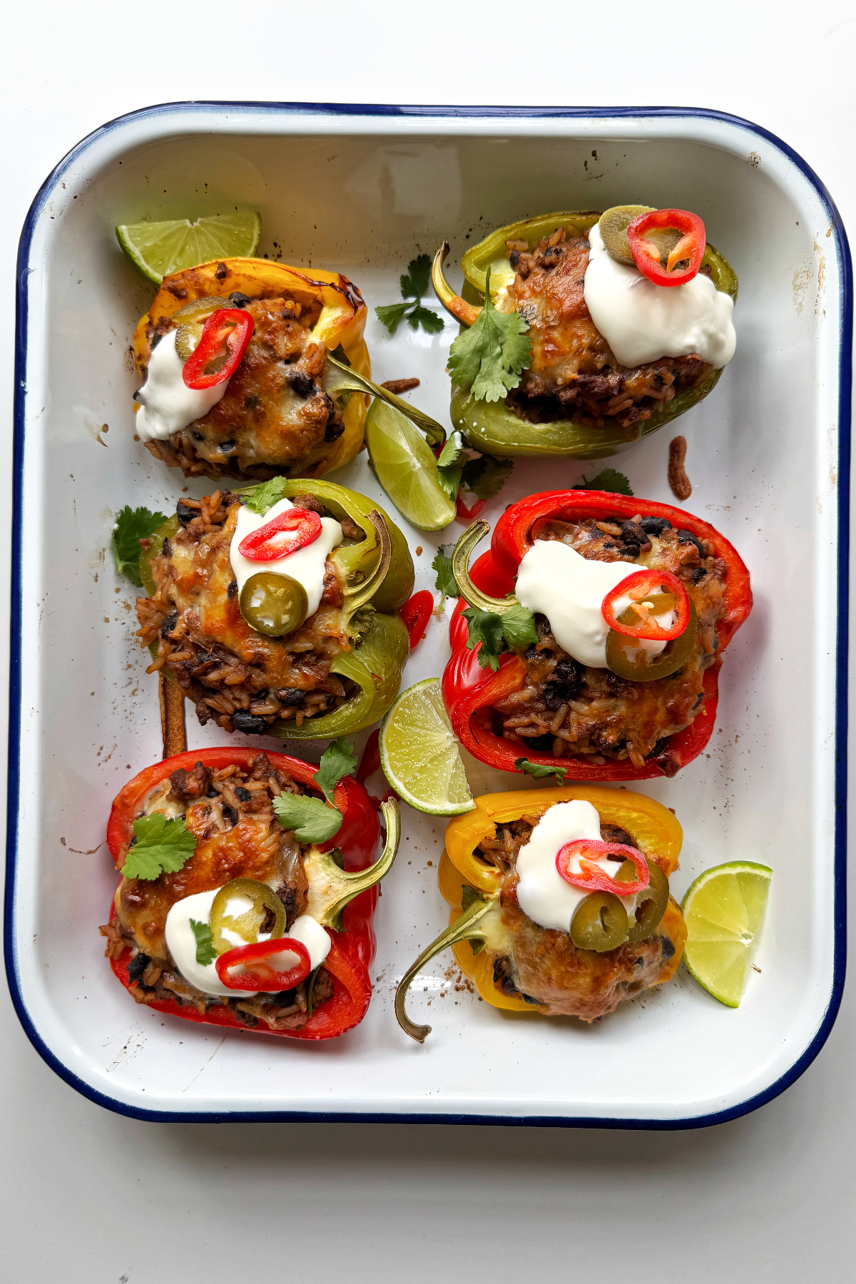 White dish with Easy Stuffed Peppers with Ground Beef and Rice