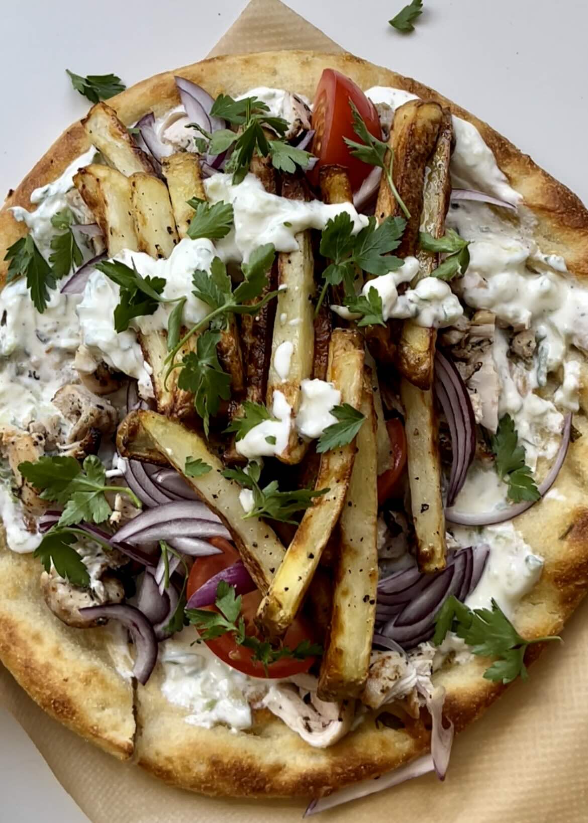A Greek chicken gyros with tzatziki