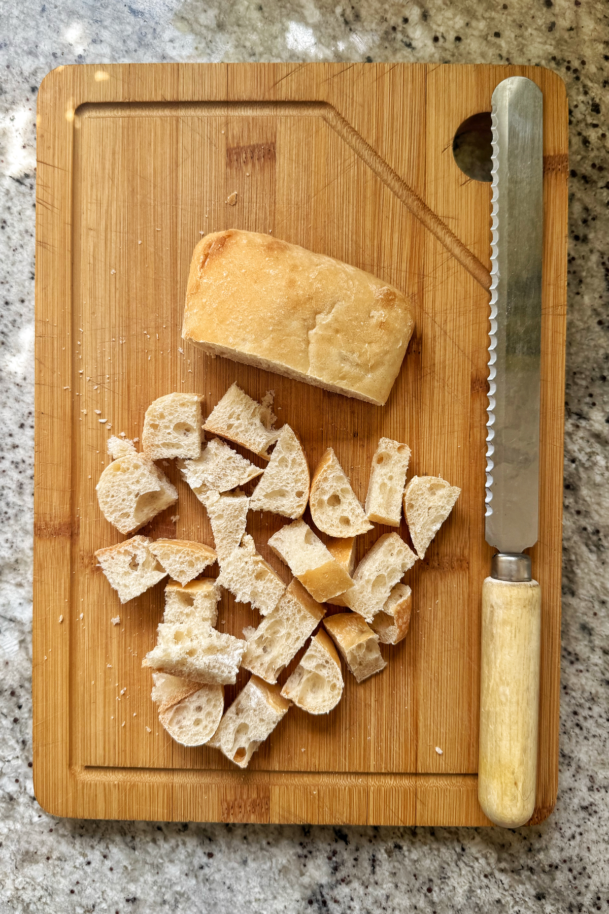 ciabatta bread sliced into cubes ready for croutons