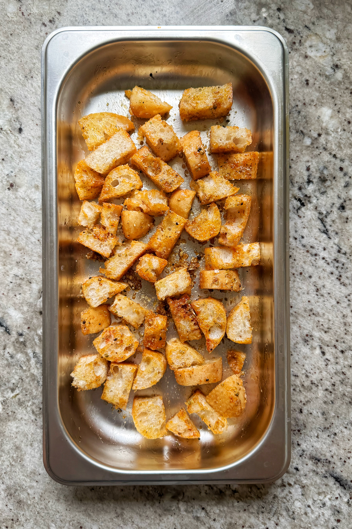ciabatta croutons on baking tray ready for oven