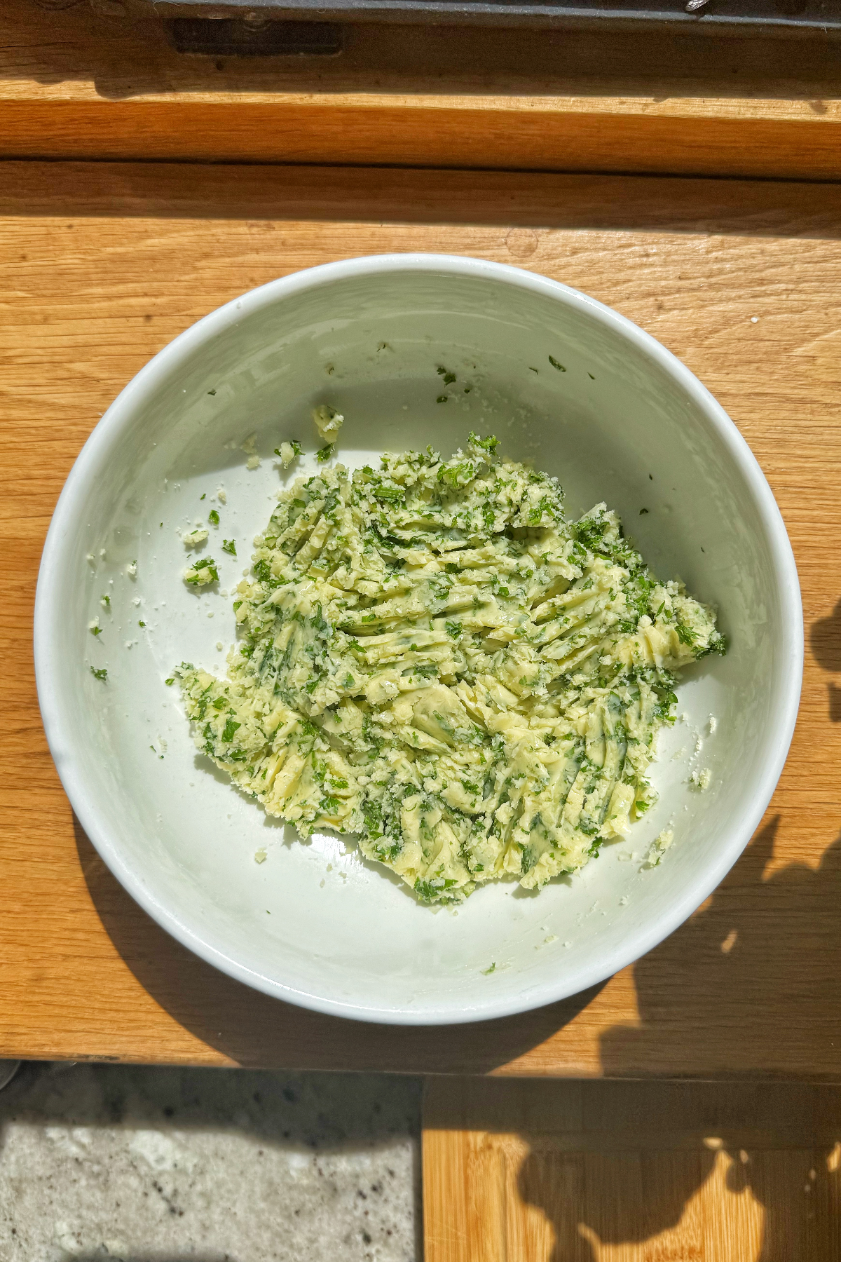 Garlic butter in a white bowl.