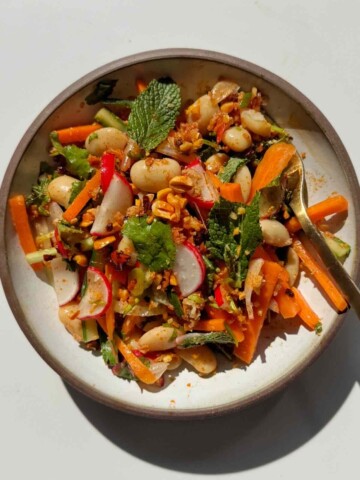 Crunchy peanuts on top of a crunchy butter bean salad.