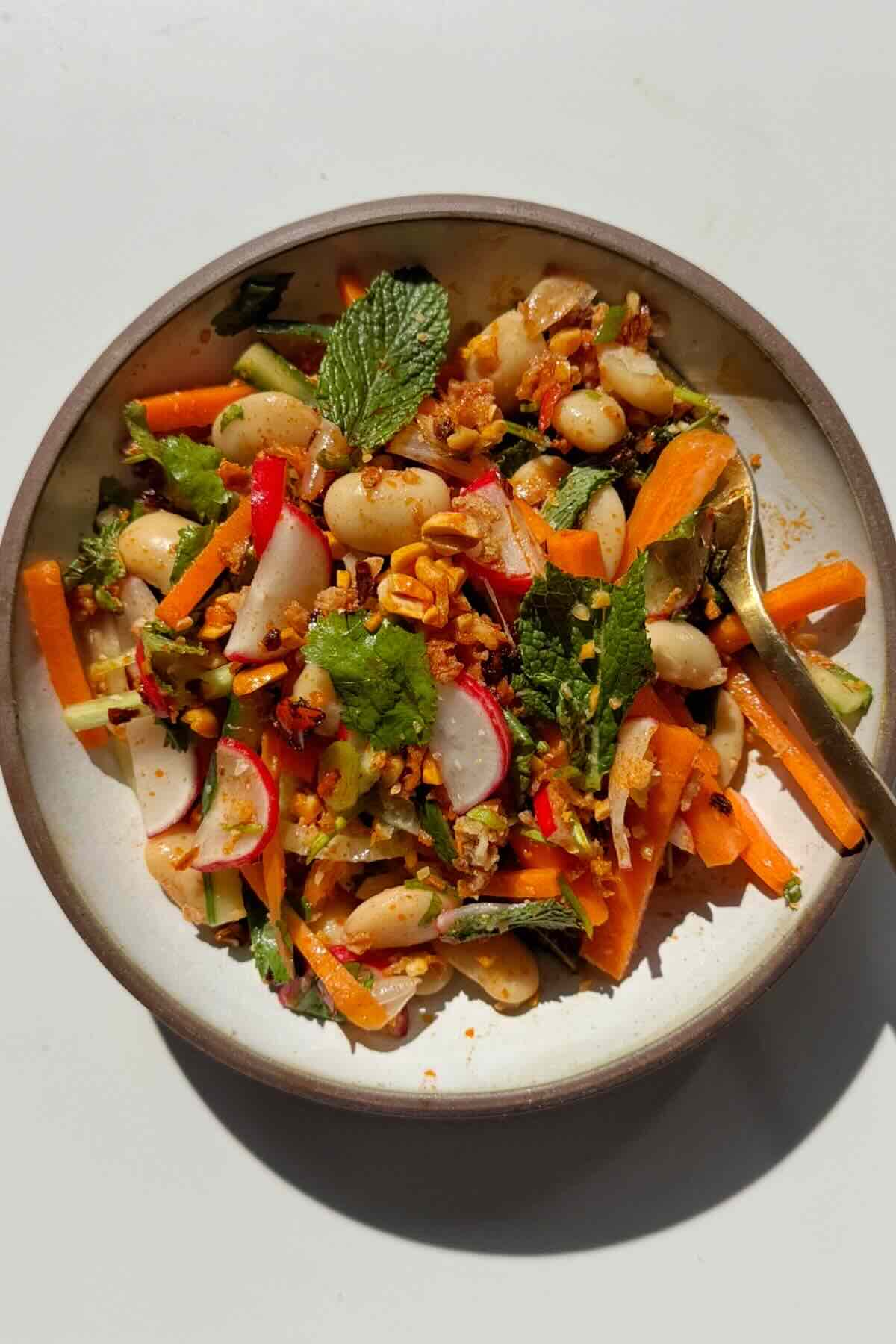 Crunchy peanuts on top of a crunchy butter bean salad. 