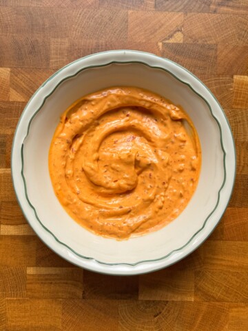 harissa aioli in a white bowl.