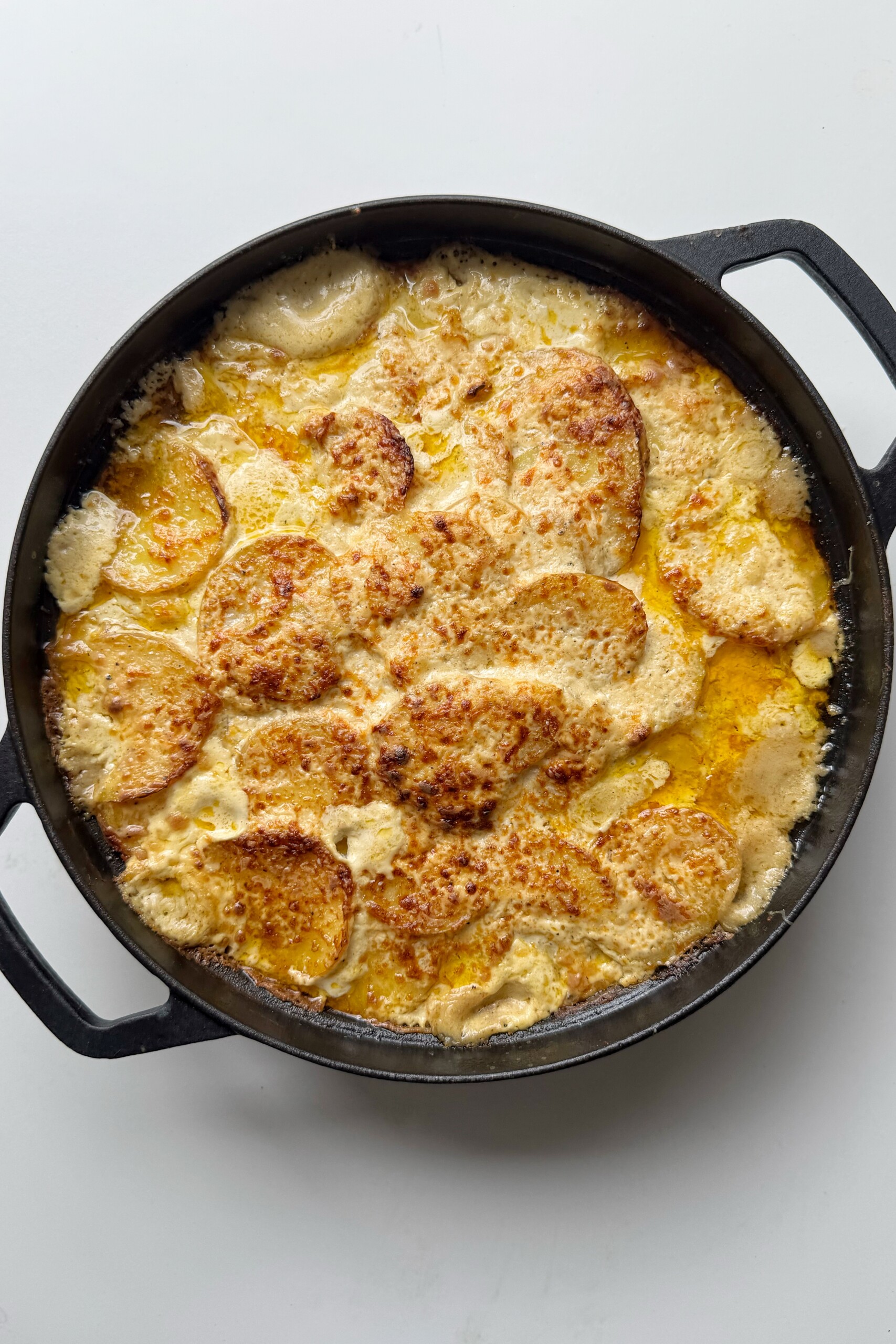 Lady Godiva dauphinoise in a black baking dish.