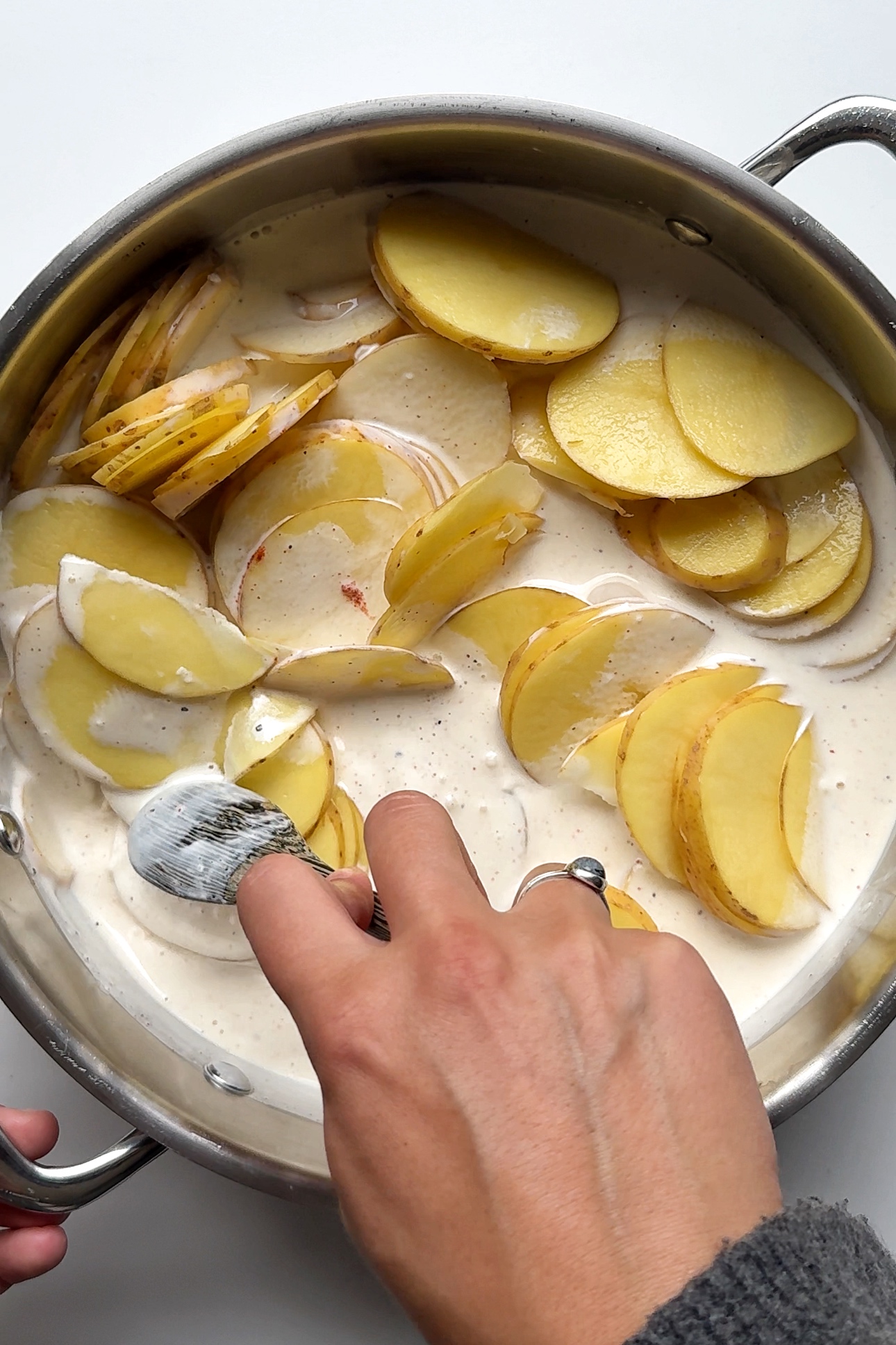 Making dauphinoise potatoes.