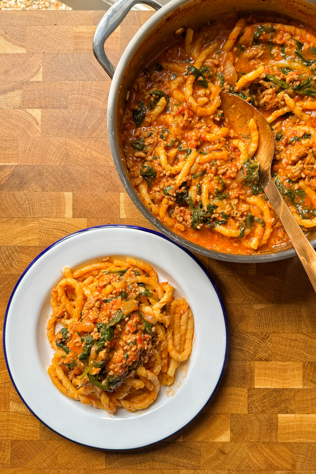 Ground turkey pasta with white bowl.