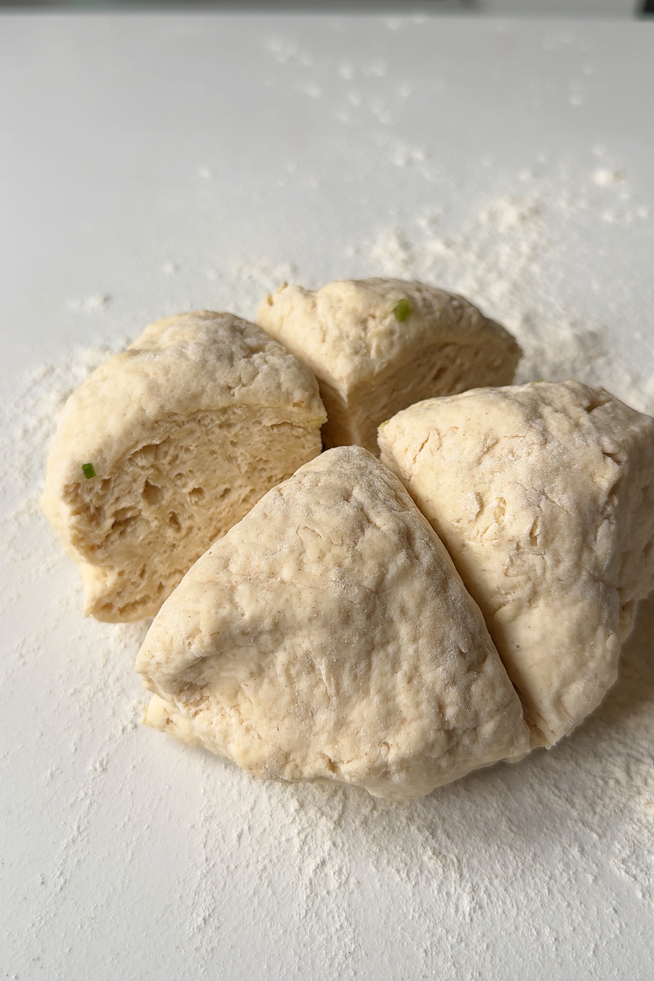 Slicing the dough into quarters.