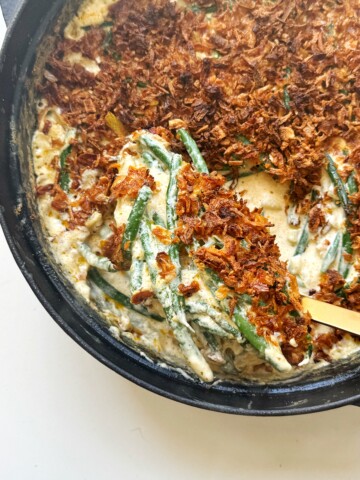Spooning green bean casserole without mushroom.