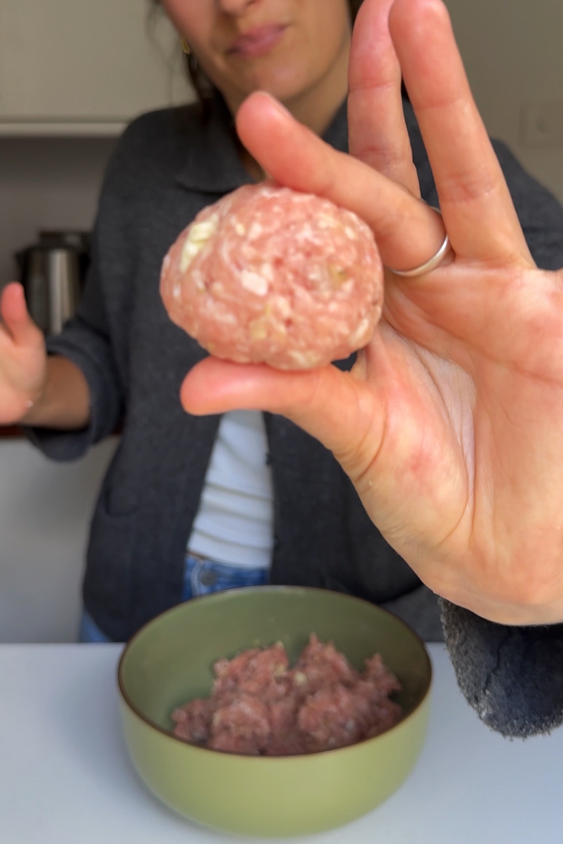 showing meatball to the camera.