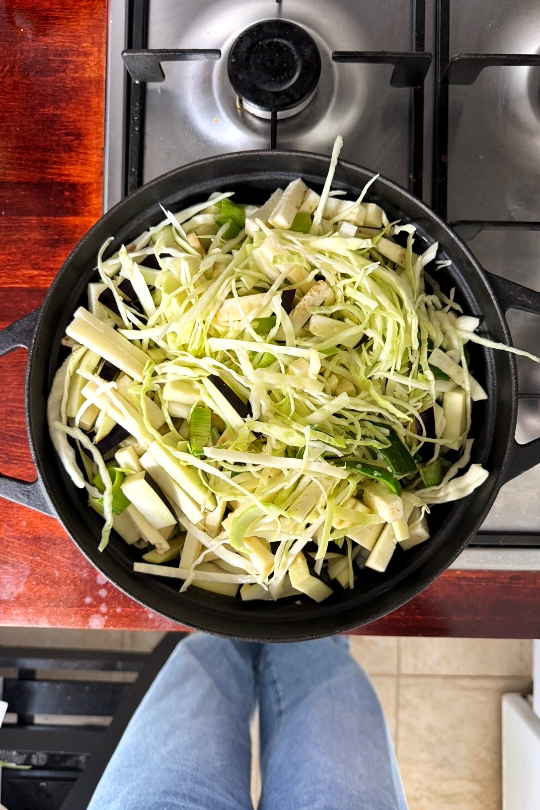 black pan with cabbage aubergine and leeks.