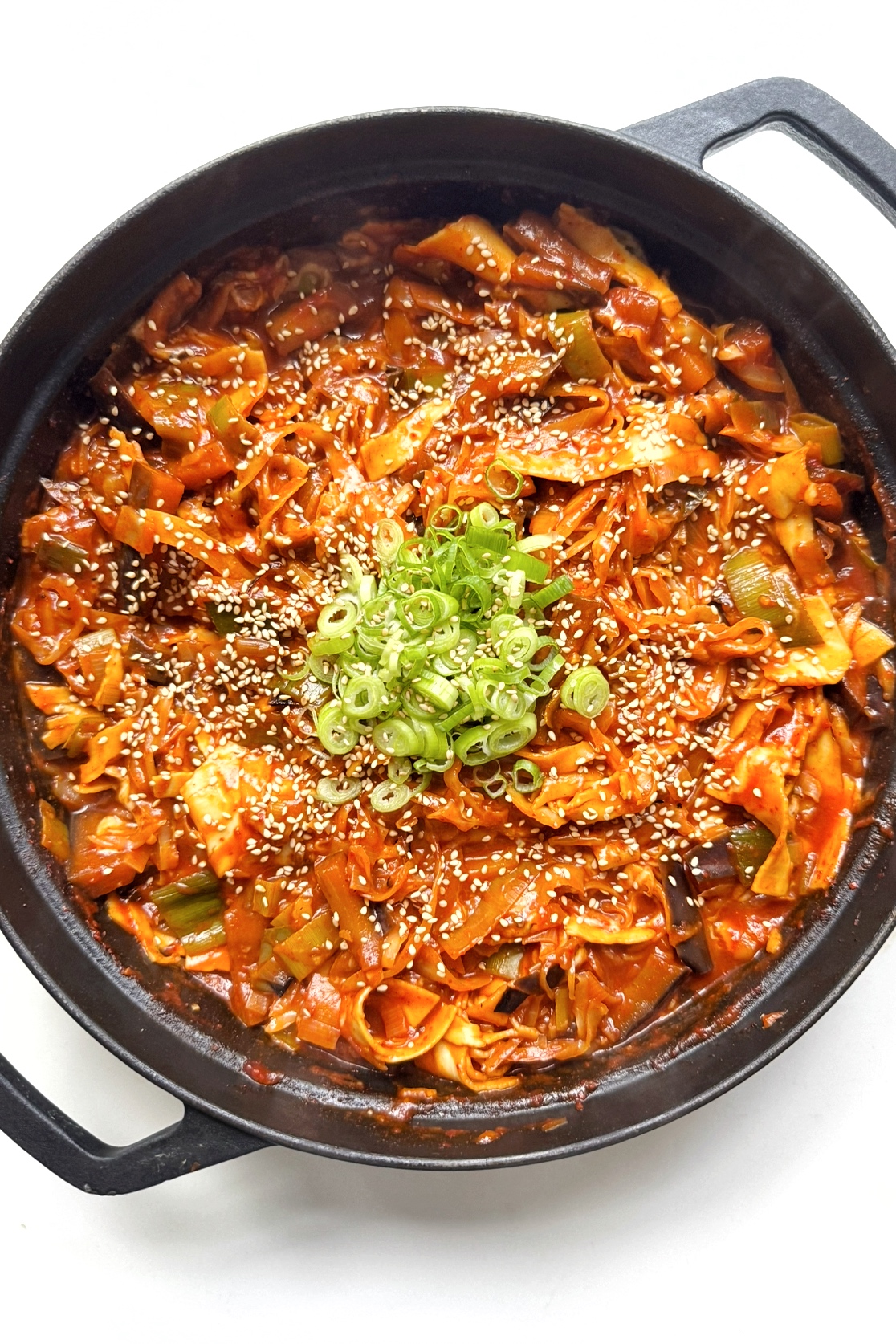 black pan with spicy gochujang lasagne in it.