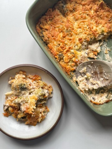 dish of broccoli casserole with a bowl of broccoli casserole.