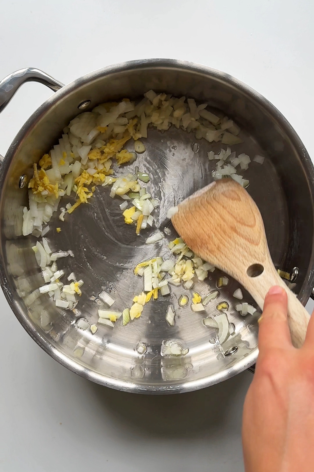 Frying off ginger, garlic, and onion.