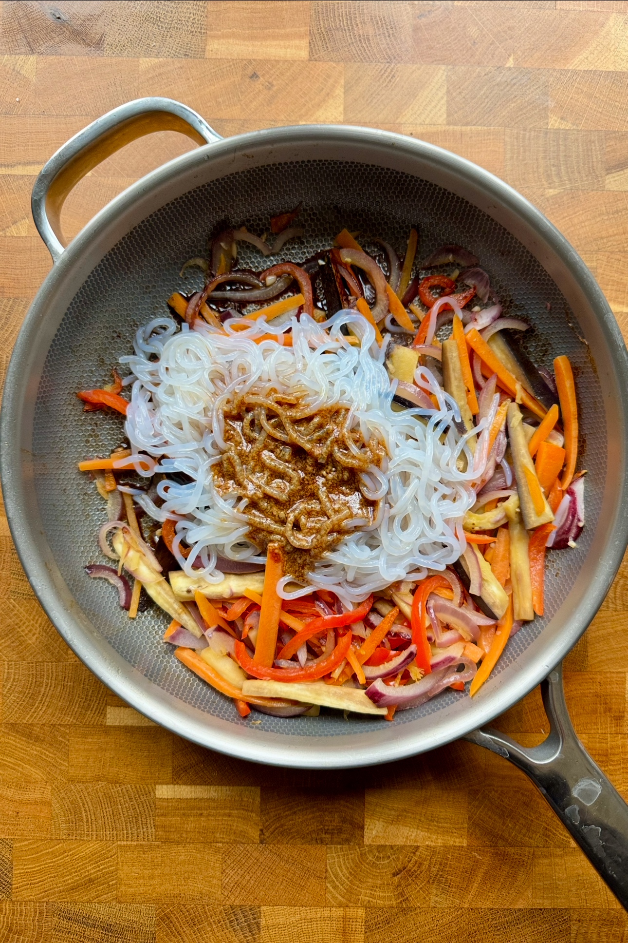 Frying shirataki noodles in pan.