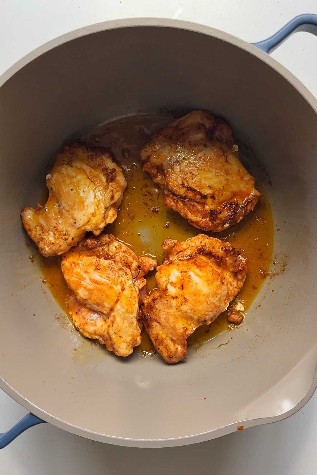 Frying off chicken thighs in pan.