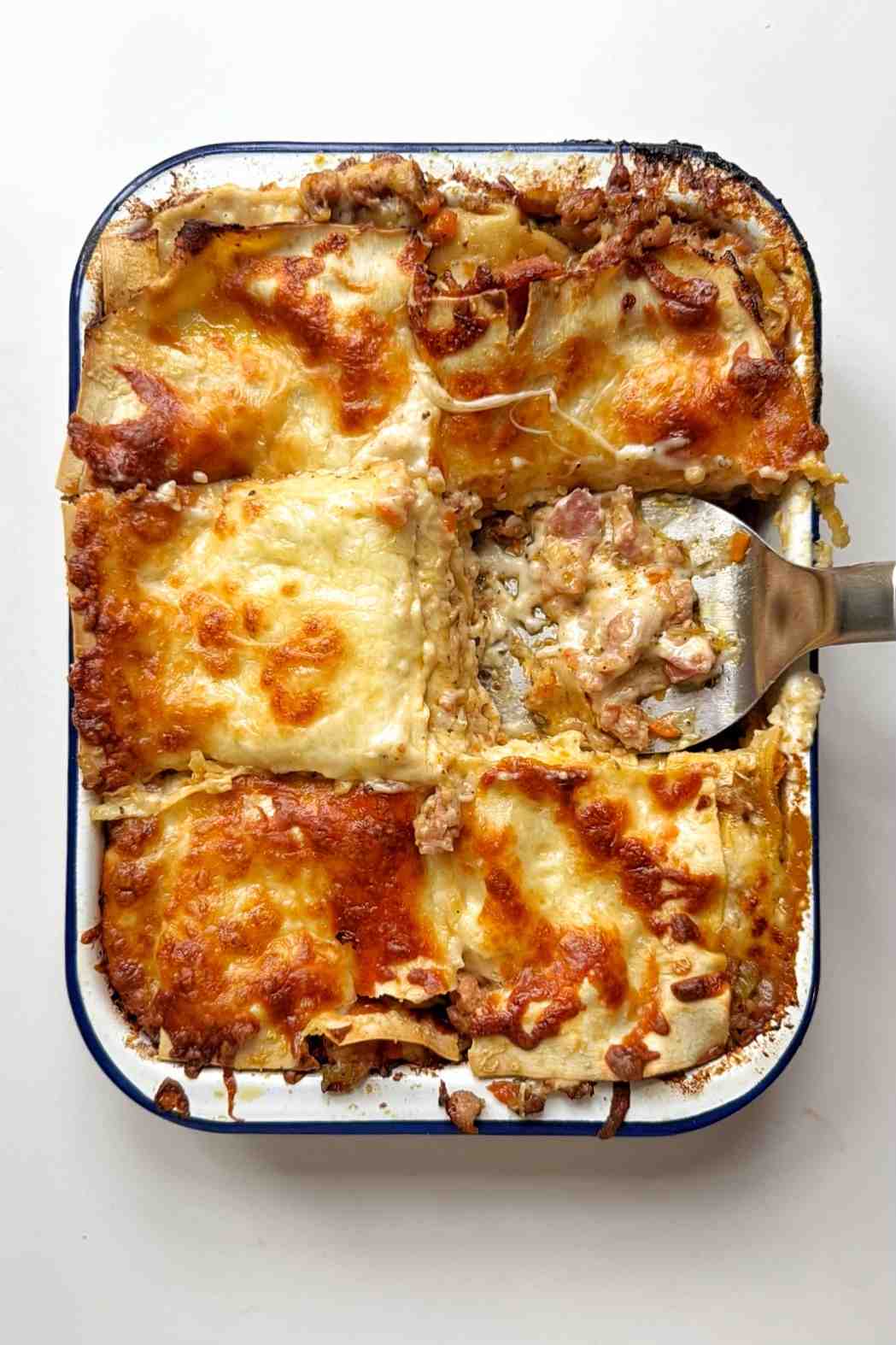 Christmas lagagna with a slice missing.