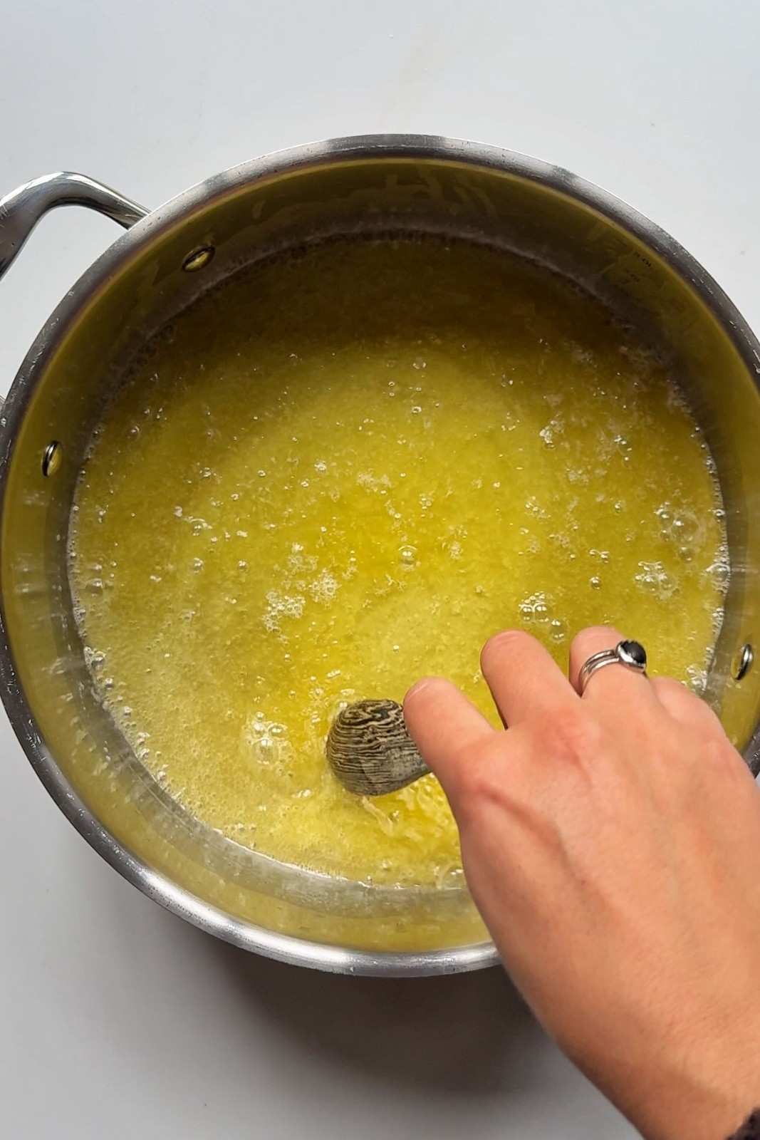 Ghee melting in a metal pot