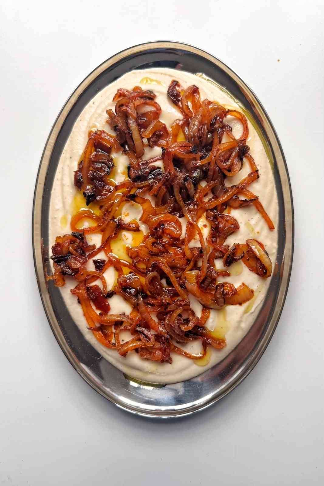 white bean dip on metal tray.