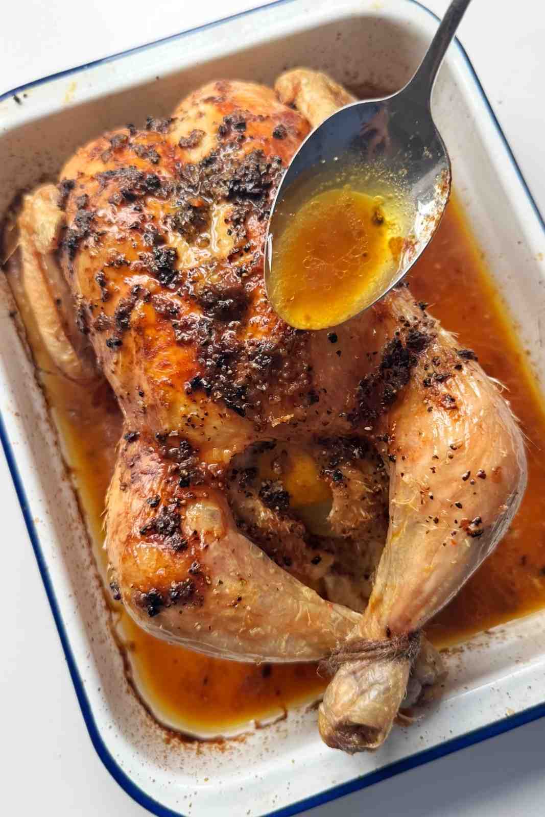 Convection oven roast chicken with soup drizzling chicken juices over the roast chicken.